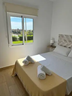 Cama o camas de una habitación en Vive Vera Rentals - Apto 1 Hab Vera Colina