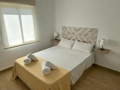 Cama o camas de una habitación en Vive Vera Rentals - Apto 1 Hab Vera Colina