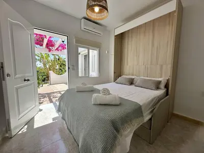Cama o camas de una habitación en Vive Vera Rentals - Acogedor Estudio Vera Colina