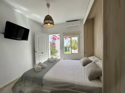 Cama o camas de una habitación en Vive Vera Rentals - Acogedor Estudio Vera Colina