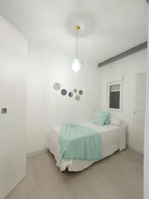 Cama o camas de una habitación en Los Santos 2 Suites, playa a 1 min, 2 Hab, WiFi y Aire acondicionado