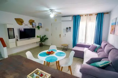 Una televisión o centro de entretenimiento en Dúplex en Vera a 200m de la Playa