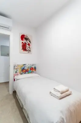 Cama o camas de una habitación en TrendyHomes Almería Playa