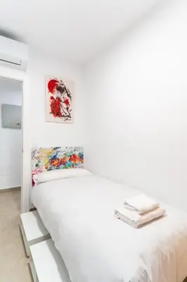 Cama o camas de una habitación en TrendyHomes Almería Playa
