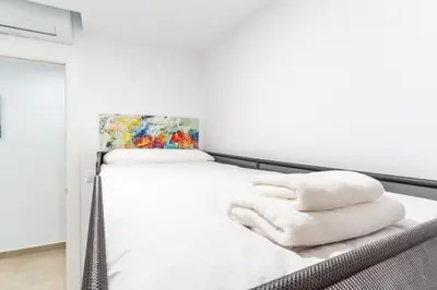 Cama o camas de una habitación en TrendyHomes Almería Playa