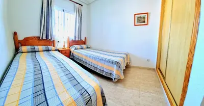 Cama o camas de una habitación en Ático con vistas al mar Veramar 5 dos dormitorios 2ª planta