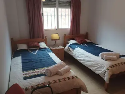 Cama o camas de una habitación en Villa Paz - Villa Familiar para 6 con piscina, AC, Wifi y parking