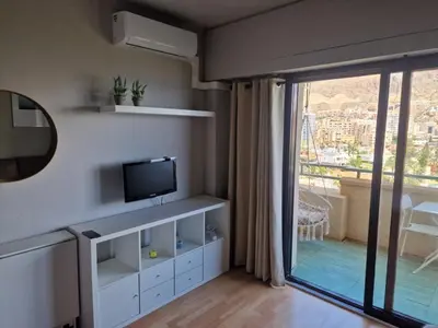 Una televisión o centro de entretenimiento en Apartamento Vista Bahía