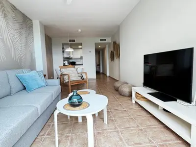 Una televisión o centro de entretenimiento en Apartamento Vera Playa