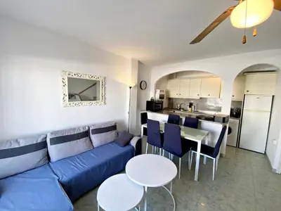 Una cocina o zona de cocina en Fuentemar Duplex - WiFi, terraza & piscina comunitaria