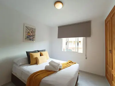 Cama o camas de una habitación en Apto Roquetas con terraza, a 1min de la playa, garaje y piscina