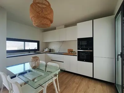 Una cocina o zona de cocina en San José Suites 3 Hab, Piscina, solárium y WiFi