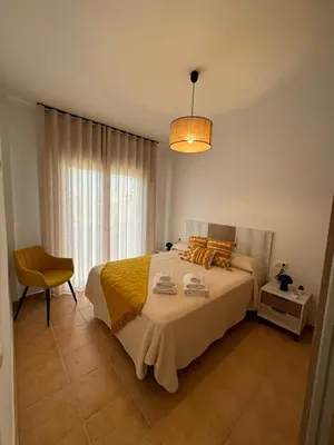 Cama o camas de una habitación en Apartamentos El Llano Málaga 7