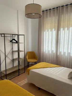 Cama o camas de una habitación en Apartamentos El Llano Málaga 7
