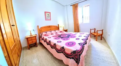 Cama o camas de una habitación en Apartamento bajo VERAMAR 1 frente a piscina 2 dormitorios