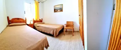 Cama o camas de una habitación en Apartamento bajo VERAMAR 1 frente a piscina 2 dormitorios