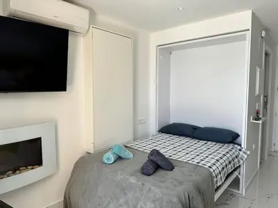 Cama o camas de una habitación en VVR Estudio naturista 1ª línea