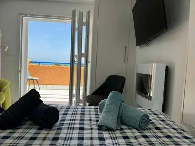 Cama o camas de una habitación en VVR Estudio naturista 1ª línea