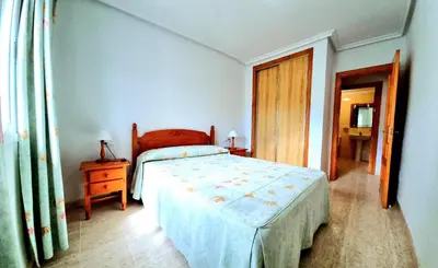 Cama o camas de una habitación en Apartamento en planta baja Veramar 5 primera línea de playa