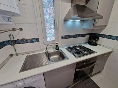 Una cocina o zona de cocina en Ático en la playa