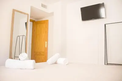 Una televisión o centro de entretenimiento en Apartamentos Luna de Águilas