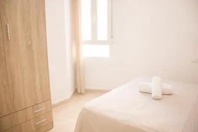 Cama o camas de una habitación en Apartamentos Luna de Águilas