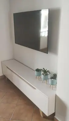 Una televisión o centro de entretenimiento en Apartamento La Amatista