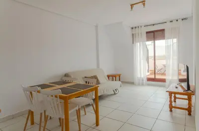 Una televisión o centro de entretenimiento en Mediterranea 8 Vera Playa Jardines tus momentos frente al mar