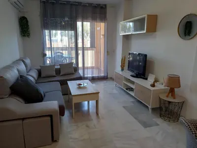Una televisión o centro de entretenimiento en Apartamento Golf