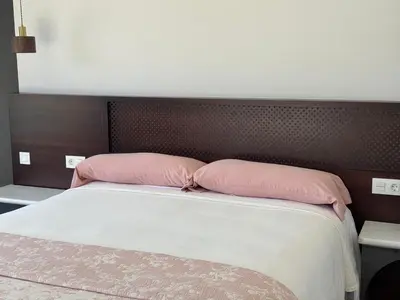 Cama o camas de una habitación en CASA YANGUAS APARTAMENTOS RURALES EN LAUJAR DE ANDARAx