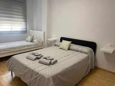 Cama o camas de una habitación en BALERMAPLAYA calle lago