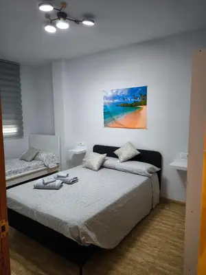 Cama o camas de una habitación en BALERMAPLAYA calle lago