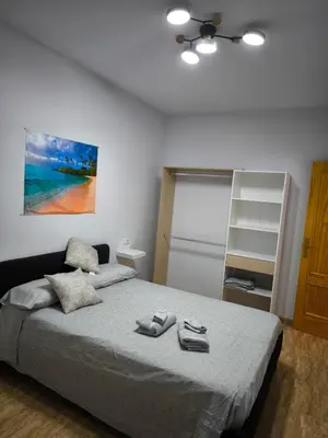 Cama o camas de una habitación en BALERMAPLAYA calle lago