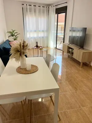 Una televisión o centro de entretenimiento en Fun and Relax Apt Playa Aguadulce