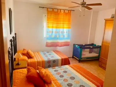 Cama o camas de una habitación en Castillo Suites, Vivienda con Fines Turísticos El Castillo de Roquetas
