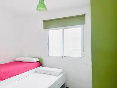 Cama o camas de una habitación en Apartamento Romanilla Roquetas