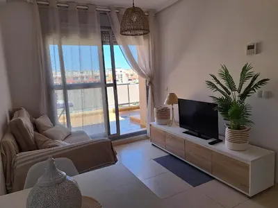 Una televisión o centro de entretenimiento en Apartamento cerca de la playa - El amanecer de Vera