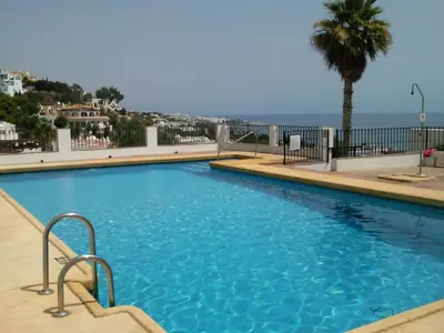Piscina en o cerca de Bonitas vistas al mar y a la montaña