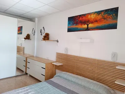 Cama o camas de una habitación en Piso primera línea playa Almería