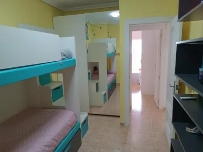 Cama o camas de una habitación en Piso primera línea playa Almería