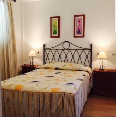 Cama o camas de una habitación en Apartamento ático naturista en Vera Playa Almeria