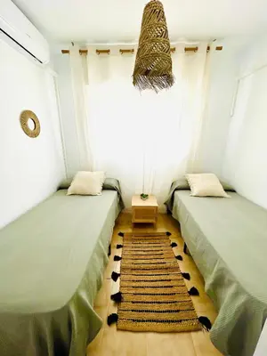 Cama o camas de una habitación en Apartamento Indalo en primera linea de playa