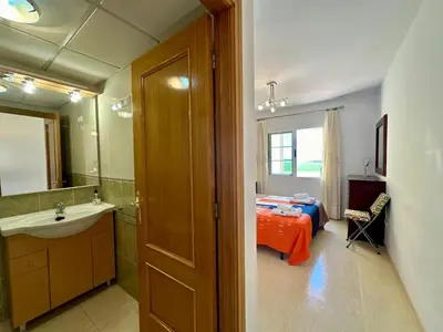 Una televisión o centro de entretenimiento en Casa Dream Beach