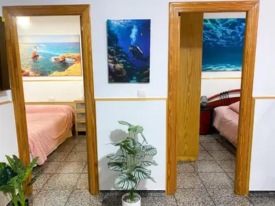 Cama o camas de una habitación en Casa Soto -Ubicacion privilegiada-Aparcamiento en tu puerta y acceso rapido a Servicios- Playas y Lugares de Interes- Netflix-Disney Plus-Prime-Full Sports TV