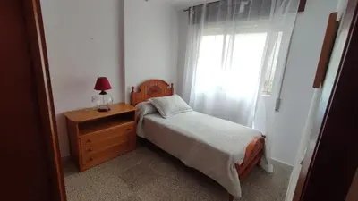 Cama o camas de una habitación en Piso céntrico san juan de los terrenos