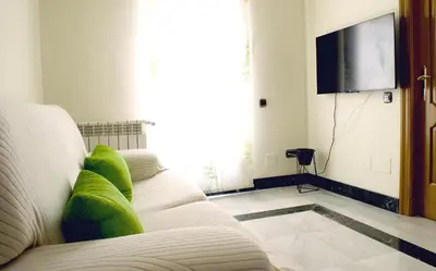 Una televisión o centro de entretenimiento en Casa del Sol y la Luna Apartamento Amanecer