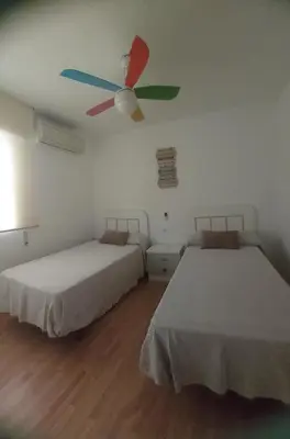 Cama o camas de una habitación en El espigón de Aguadulce