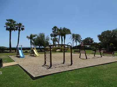 Zona de juegos infantil en ÁTICO NUEVO VERA SOLARiUM URBANIZACION A PIE DE PLAYA