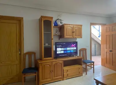 Una televisión o centro de entretenimiento en APARTAMENTO VERAMAR 6 WiFi-Smart- TV