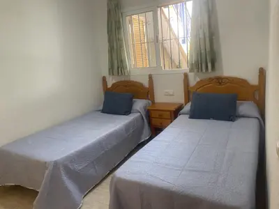 Cama o camas de una habitación en APARTAMENTO VERAMAR 6 WiFi-Smart- TV